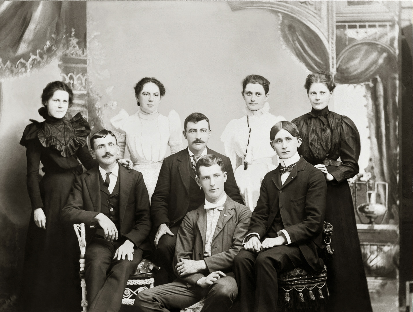 [Children of John & Angeline McManus: Mary E. & her daughter Anna, Agnes B. & Cecilia J,; Henry T., George F., & Eugnee J.; Daniel Coady (probable)] Studio: St. John, Erie PA
